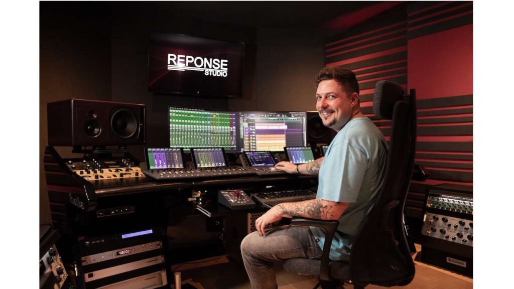 David Brand at Reponse Studio working at the mixing console with PSI Audio A25-M studio monitors.
